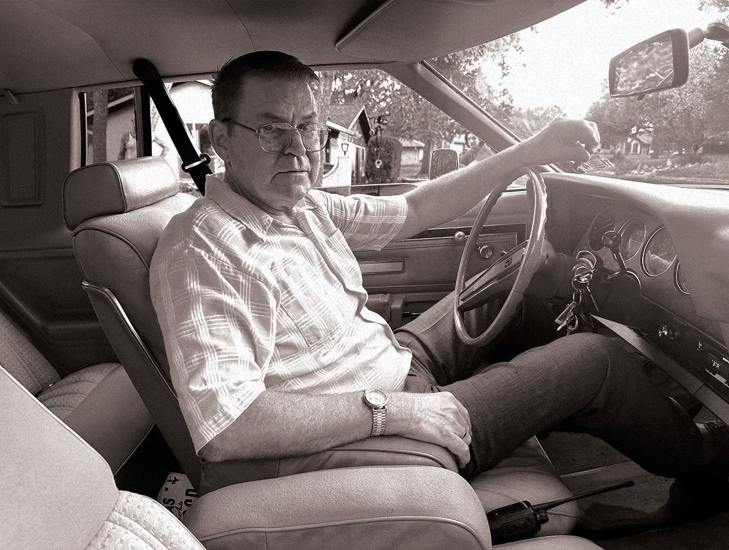 Bill Wise at the wheel, in black and white