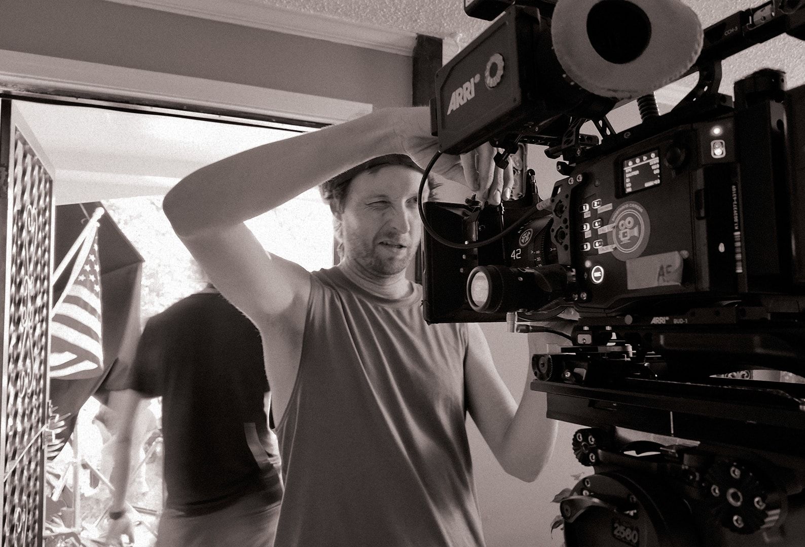 The operator adjusting the camera in a doorway